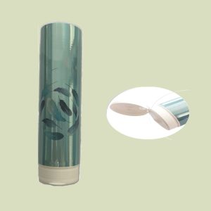 Mono-material squeeze tube with a transparent body and sleek leaf design, ideal for sustainable and recyclable skincare packaging.