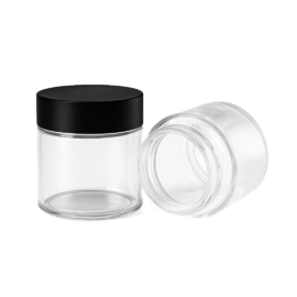 premium jars child resistant glass jars in a studio setting one jar standing with a cap and one jar laying down with no cap